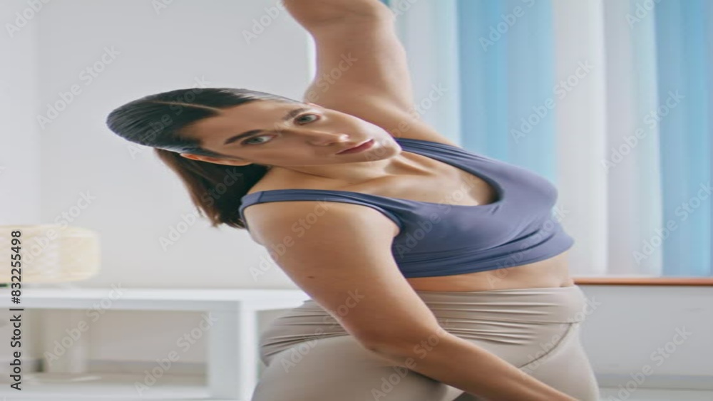 Sport woman training slopes at home vertical. Lady warming body up stretching Sport woman training slopes at home vertical. Lady warming body up stretching