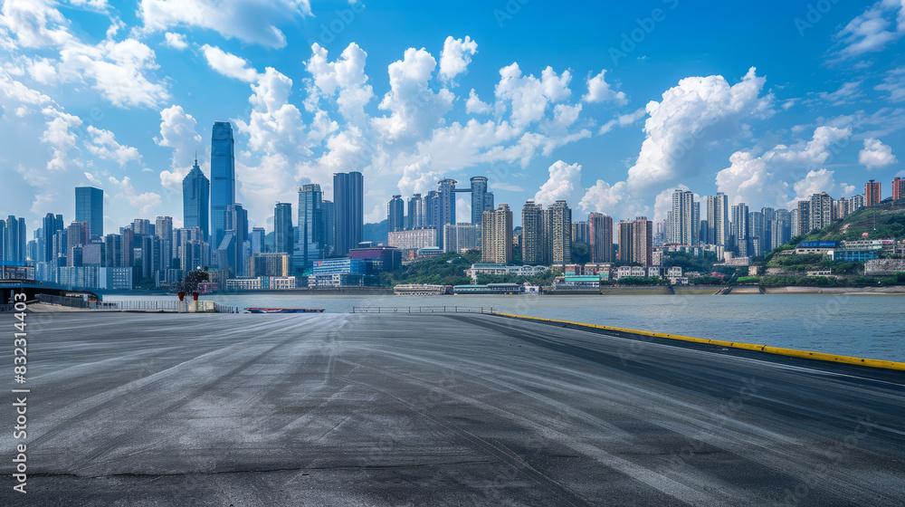 Fototapeta premium Modern city skyline with skyscrapers and empty asphalt road
