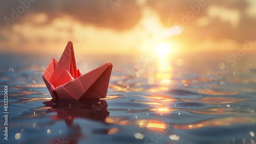 A red origami boat floats peacefully on the water under a stunning sunset, surrounded by gentle ripples and warm, golden light. photo