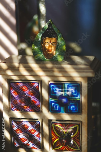 Buddha image under striped light reflection photo