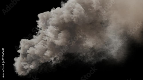 The eruption of a smoke bomb that is blown away by the wind.
