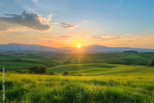 Picturesque sunset over a serene countryside with rolling hills and lush meadows