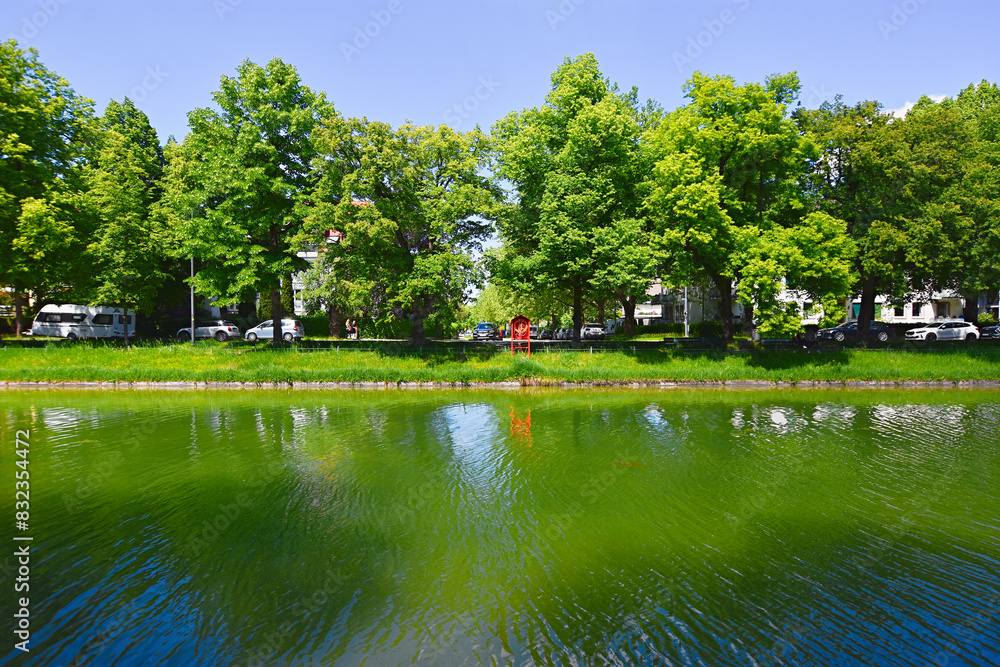Fototapeta premium Green landscape on the Nymphenburg canal in Munich, Germany