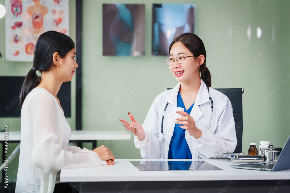 Asian female doctor specializing in psychiatry online consultations from desk, psychotherapy, diagnosis, treatment, counseling to psychiatric patients disorders depression, anxiety, schizophrenia. Asian female doctor specializing in psychiatry online consultations from desk, psychotherapy, diagnosis, treatment, counseling to psychiatric patients disorders depression, anxiety, schizophrenia.
