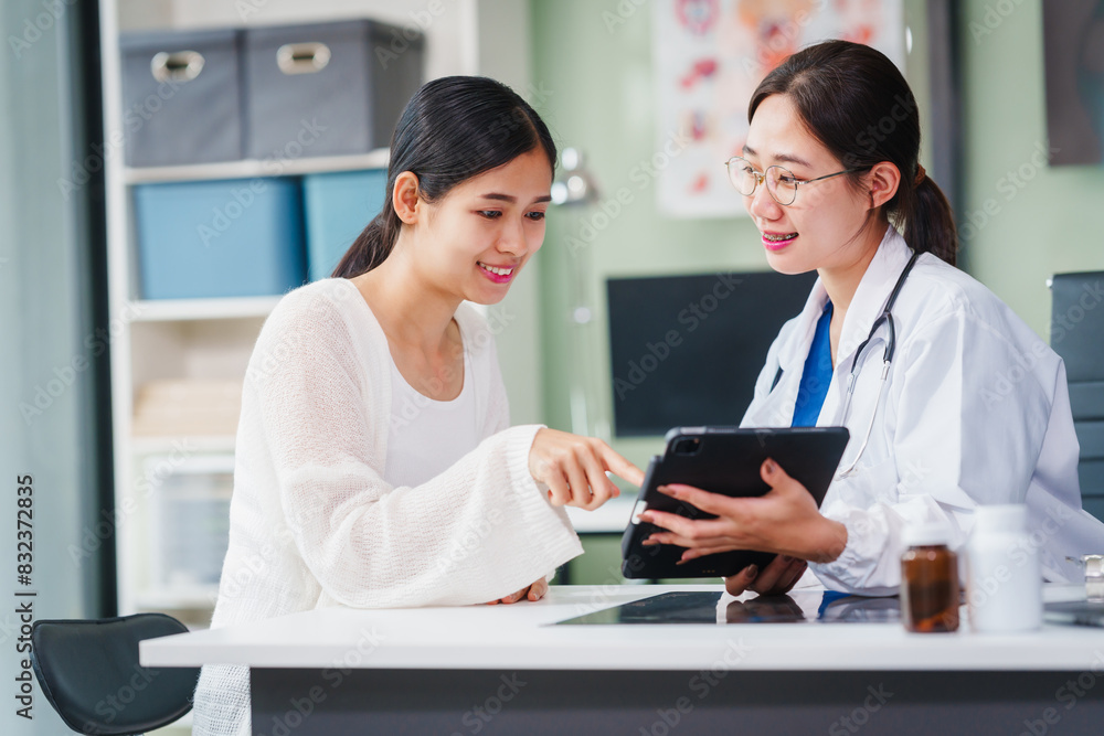 Asian female doctor specializing in psychiatry online consultations from desk, psychotherapy, diagnosis, treatment, counseling to psychiatric patients disorders depression, anxiety, schizophrenia. Asian female doctor specializing in psychiatry online consultations from desk, psychotherapy, diagnosis, treatment, counseling to psychiatric patients disorders depression, anxiety, schizophrenia.