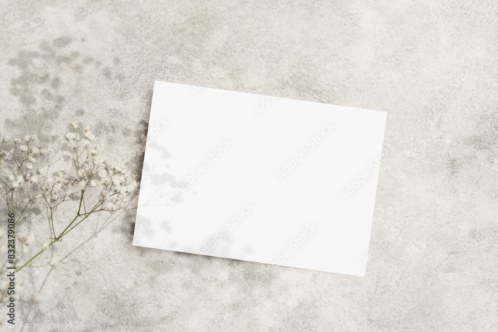 Wedding invitation card mockup with dry gypsophila flowers decor, copy space for card design presentation Wedding invitation card mockup with dry gypsophila flowers decor, copy space for card design presentation