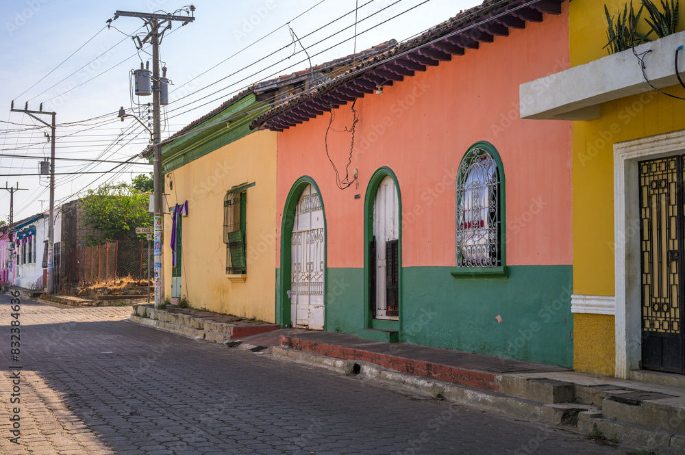 Fototapeta premium Izalco, Sonsonate El Salvador. February 25, 2024. Typical architecture of the city of Izalco. Houses with contrasting colors.
