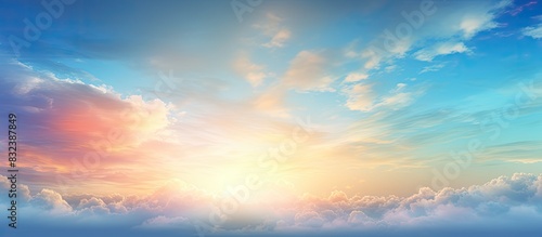 The vibrant sky background is filled with drifting clouds carried by the wind while the sun s rays paint the blue canvas This scene evokes the idea of an overcast sky with beautiful sunrises and suns photo