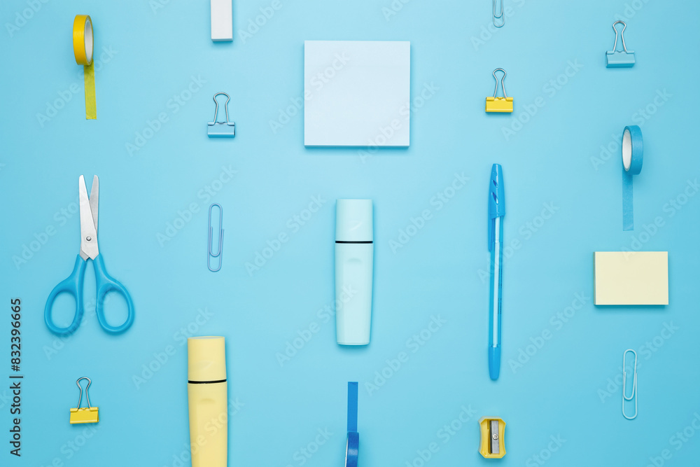 Various school office on blue background. Back to school concept. Top view Various school office on blue background. Back to school concept. Top view
