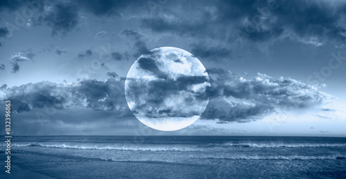 Fototapeta Naklejka Na Ścianę i Meble -  Night sky with full bright moon in the clouds 