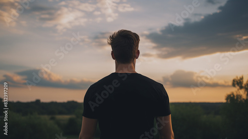male model looking at the sunset, wearing a blank black t-shirt, Ai Generated Images © mohammad