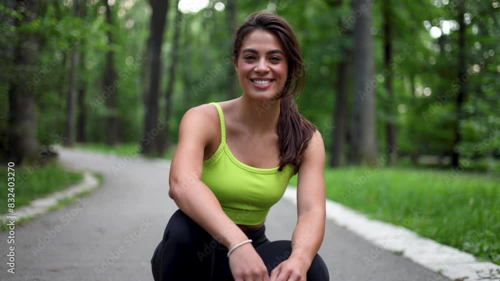 Beautiful, young woman taking a break while running and enjoying in the nature Beautiful, young woman taking a break while running and enjoying in the nature