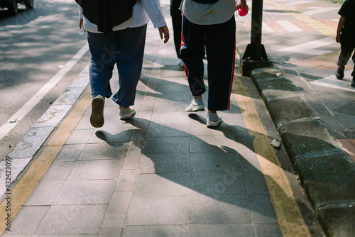 Canvas Print "A pedestrian exercising on their way to a public sports facility, capturing the spirit of urban fitness and activity
