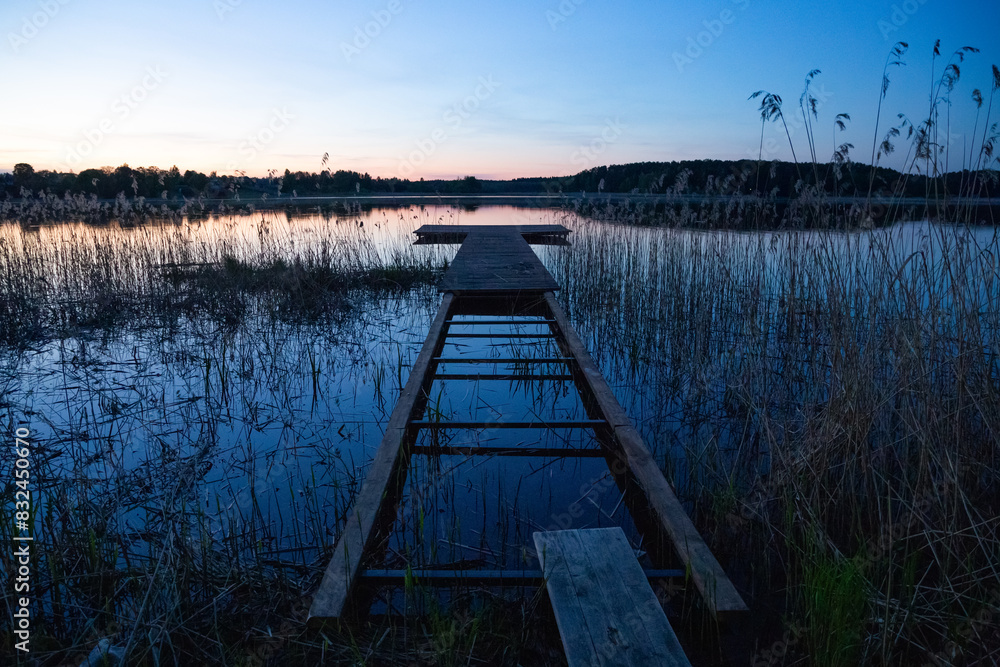 Fototapeta premium View of the lake shore at sunset