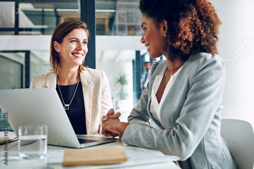 Laptop, partnership and woman in office with financial advisor for proposal, teamwork and discussion. Strategy, planning and business people brainstorming with advice, ideas and research for growth