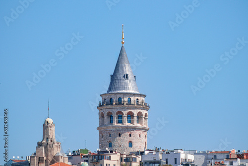 A closer look at the Galata Tower emphasises its medieval charm and architectural elegance with its solid stone walls and iconic conical roof.