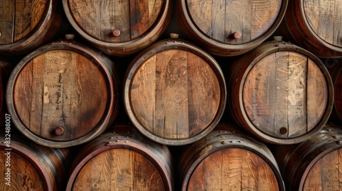 Background of weathered wooden wine barrels, ideal for winery themes © Sasint