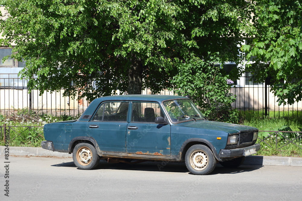 An old dark green Soviet car in the courtyard of a residential building, Badaeva Street, St. Petersburg, Russia, May 29, 2024 An old dark green Soviet car in the courtyard of a residential building, Badaeva Street, St. Petersburg, Russia, May 29, 2024