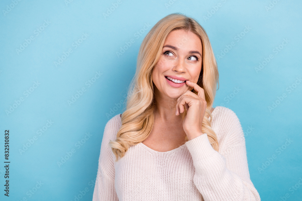 Photo of charming adorable woman wear trendy white clothes look empty space isolated on blue color background Photo of charming adorable woman wear trendy white clothes look empty space isolated on blue color background