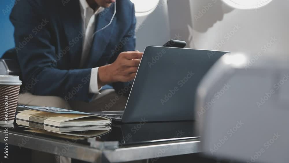 Side view portrait of handsome bearded businessman working while enjoying flight in first class, copy space Side view portrait of handsome bearded businessman working while enjoying flight in first class, copy space