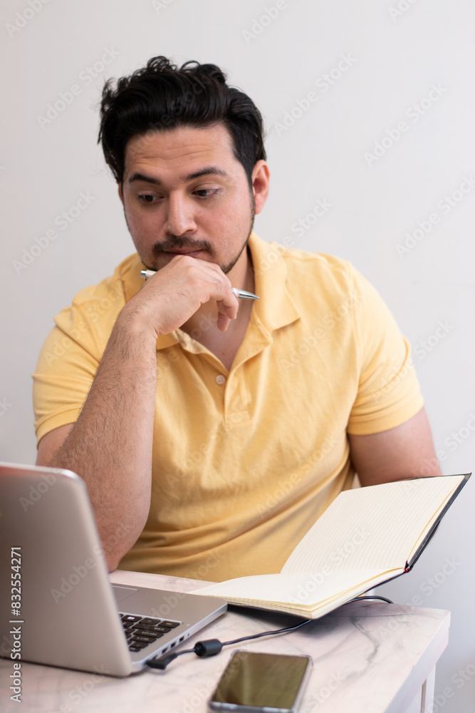 Young student with stress trying to resolve a problem in his laptop Young student with stress trying to resolve a problem in his laptop
