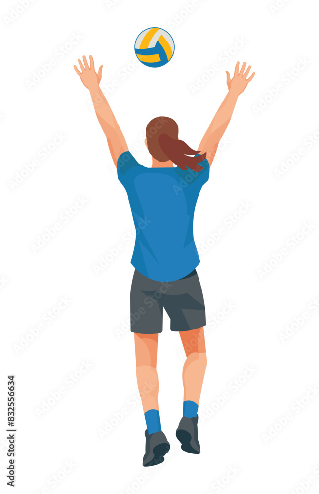 Women's volleyball girl player in a blue T-shirt from the back who jumps straight with her arms raised high to catch or block the ball