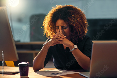 Stressed out, black businesswoman and working late night on laptop for work deadline with problem. Corporate, content writer and office with upset person, mental health issues and worrying in company