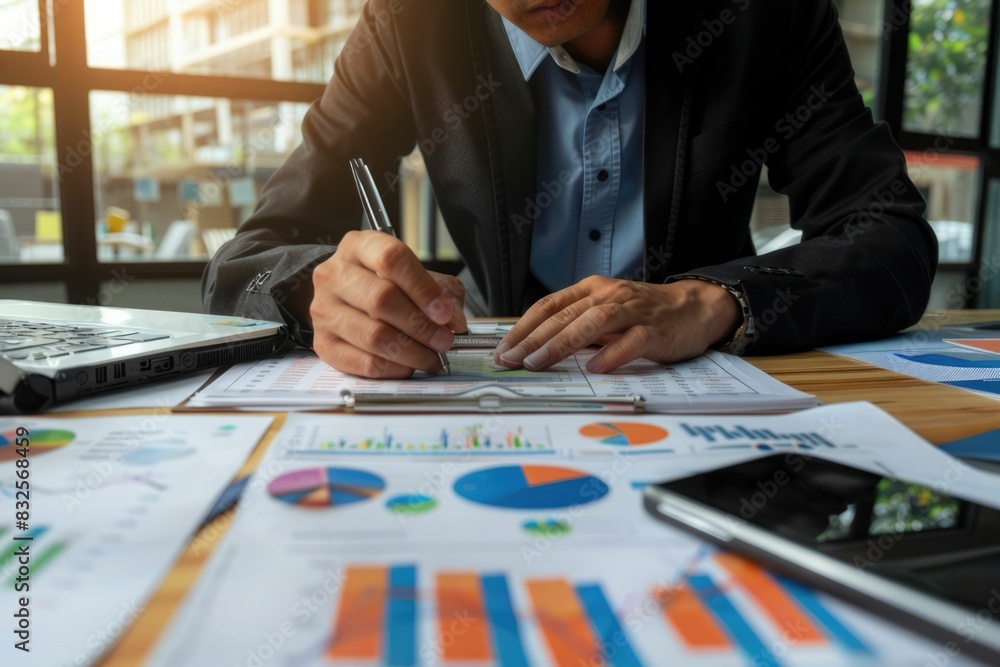 Businessman working with documents analyzing business and planning financial accounting. Businessman working with documents analyzing business and planning financial accounting.