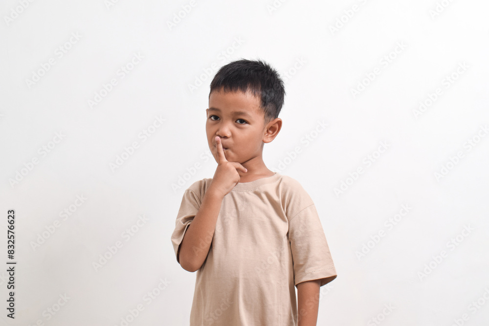 Image of Asian child posing on white background. portrait of an asian boy Image of Asian child posing on white background. portrait of an asian boy