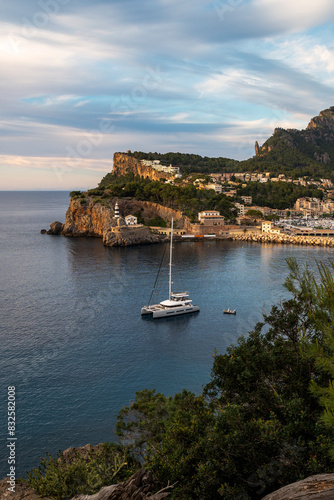 Sa Creu old lighthouse guarding the entrance of Port de Soller harbor, Sierra de Tramontana mountains, Majorca, Balearic Islands, Spain