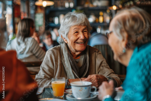 Vibrant Conversations: Happy Senior Woman Sharing Life Stories with Friends at Outdoor Cafe, Expressive and Engaging Faces Reflecting Wisdom and Joy