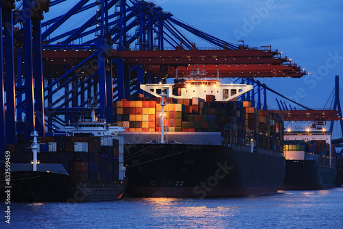 Cargo Ship Docked at Industrial Port — Without Branding and Ship Names.