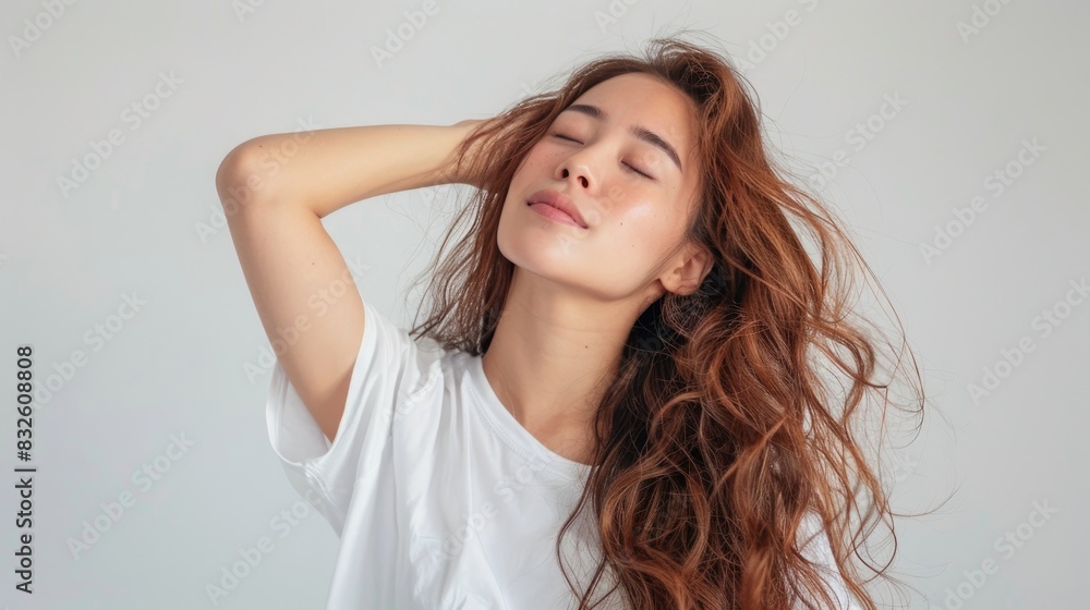 Portrait photo of Asian model, white shirt, long golden brown hair, in her early 20s. Portrait photo of Asian model, white shirt, long golden brown hair, in her early 20s.