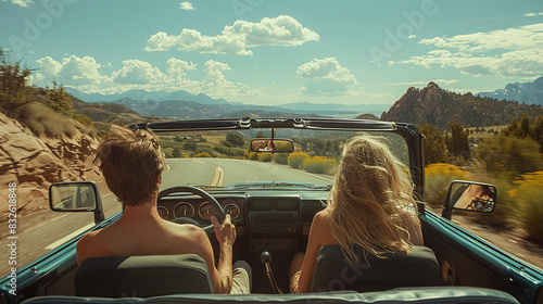 Couple Enjoying a Scenic Road Trip in a Convertible © swissa