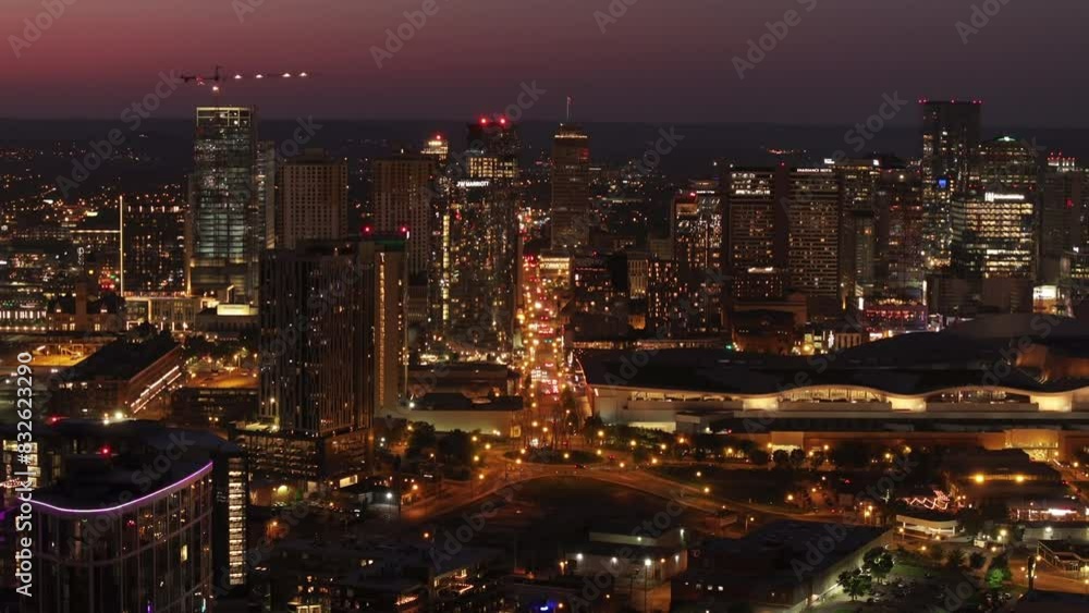 Lively nightlife of downtown Nashville as the city lights up at twilight. Stunning aerial view captures the vibrant skyline and illuminated streets Lively nightlife of downtown Nashville as the city lights up at twilight. Stunning aerial view captures the vibrant skyline and illuminated streets