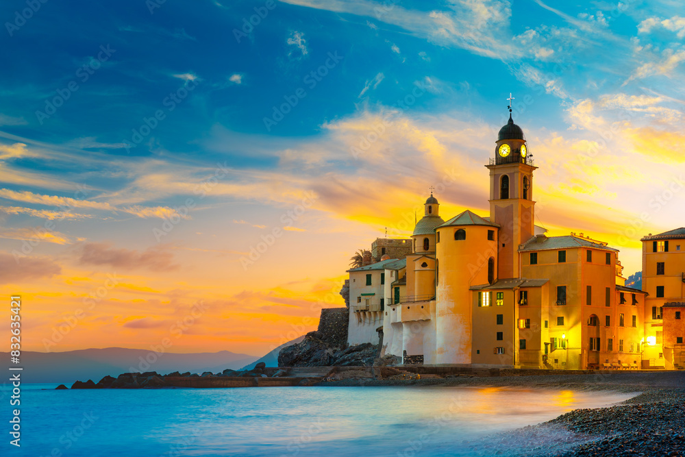 Scenic Mediterranean riviera coast. Panoramic view of Camogli town in Liguria, Italy. Basilica of Santa Maria Assunta and colorful palaces. Liguria, Italy