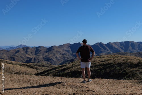 Man admiring the Namib Desert, Africa Namibia