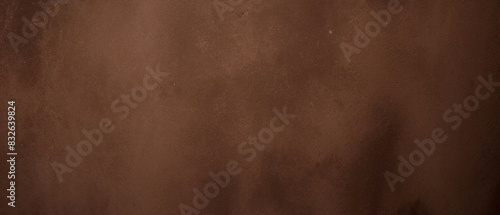 Close-up texture of reddish-brown surface with rugged and cracked patterns photo