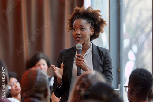 Afro American businesswoman delivering powerful keynote address on classroom photo