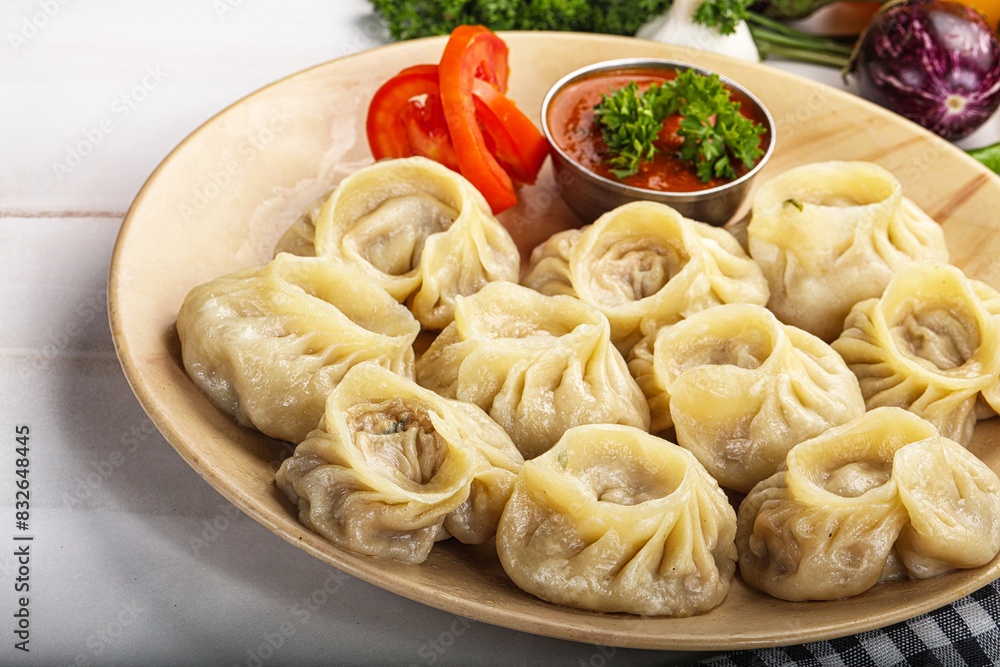 Steamed Nepali dumpling Momo with sauce Steamed Nepali dumpling Momo with sauce
