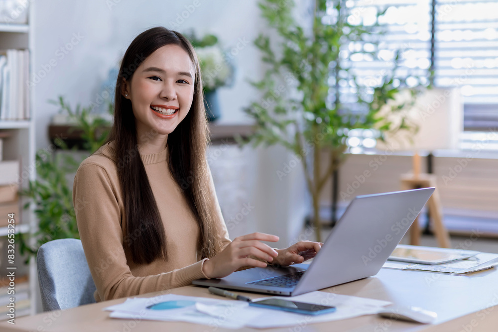 Attractive asian young confident businesswoman working at the office. Smiling young Asian business woman leader entrepreneur, professional manager Attractive asian young confident businesswoman working at the office. Smiling young Asian business woman leader entrepreneur, professional manager