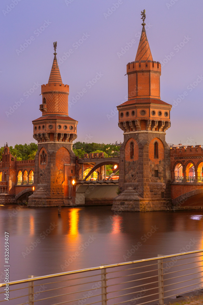 Old Berlin Oberbaum Bridge over the Spree River at sunset.
