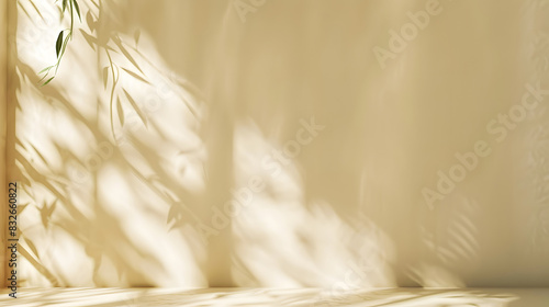 Minimalistic abstract gentle light beige background for product presentation with light andand intricate shadow from the window and vegetation on wall. photo
