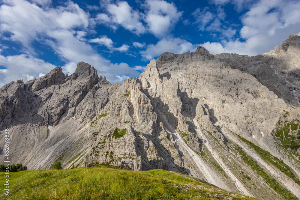Dolomites beautiful mountain landscape on a sunny day. Hiking in the Alps in Italy, South Tirol mountain range of Alpi Dolomiti di Sesto near Cortina di Amprezzo and Tre Cime di Lavaredo alpine scene Dolomites beautiful mountain landscape on a sunny day. Hiking in the Alps in Italy, South Tirol mountain range of Alpi Dolomiti di Sesto near Cortina di Amprezzo and Tre Cime di Lavaredo alpine scene