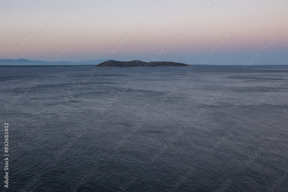 Fototapeta premium A small lonely island in the middle of the sea