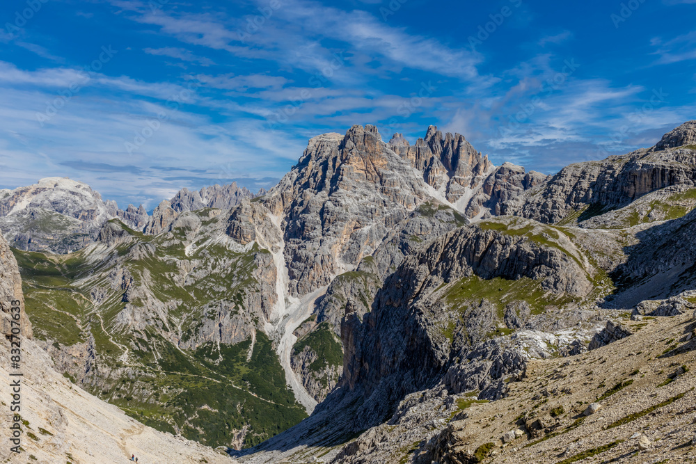 Fototapeta premium Dolomites beautiful mountain landscape on a sunny day. Hiking in the Alps in Italy, South Tirol mountain range of Alpi Dolomiti di Sesto near Cortina di Amprezzo and Tre Cime di Lavaredo alpine scene