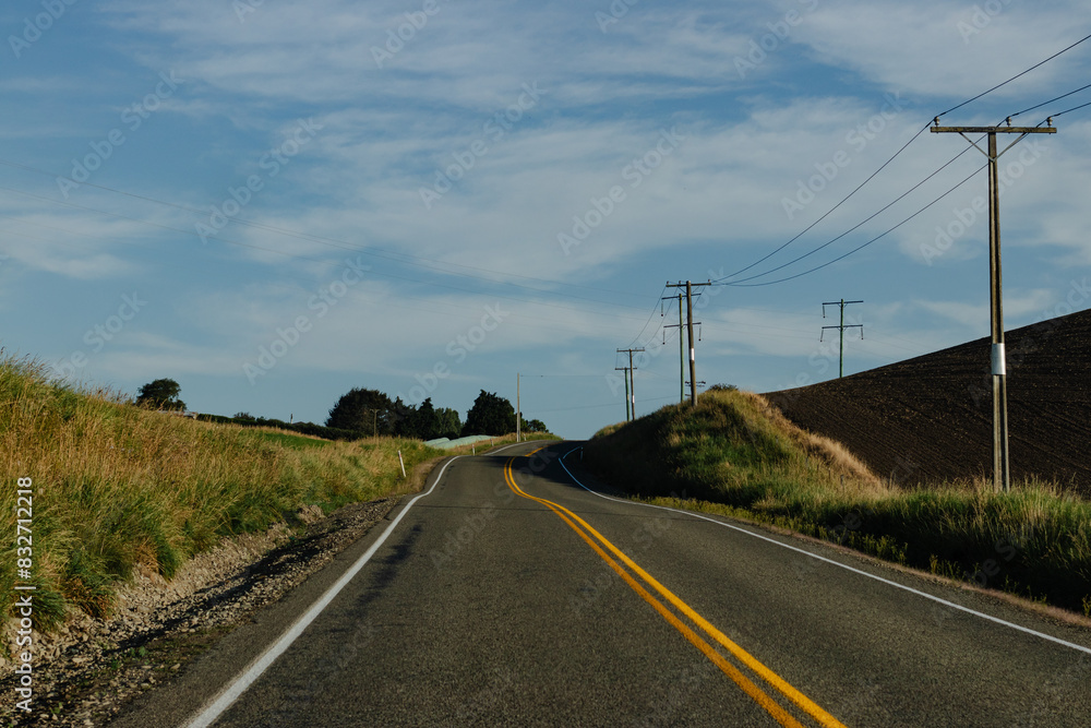 Open Road with Power Lines New Zealand No People afternoon outside Open Road with Power Lines New Zealand No People afternoon outside