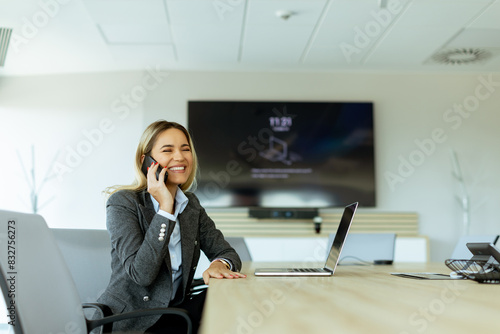 Happy businesswoman engages...