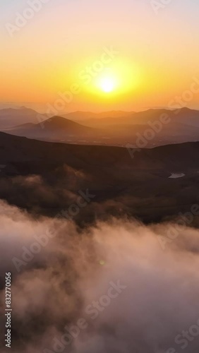 Top view of the clouds in the morning light. Aerial view of cumulus clouds. Sunlighten cumulus clouds under horizon. over the cumulus clouds in the morning. photo