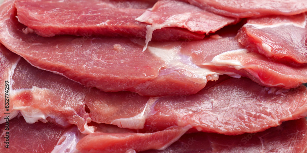Fresh pink raw turkey fillets with layers of white fat. Meat texture close up Fresh pink raw turkey fillets with layers of white fat. Meat texture close up